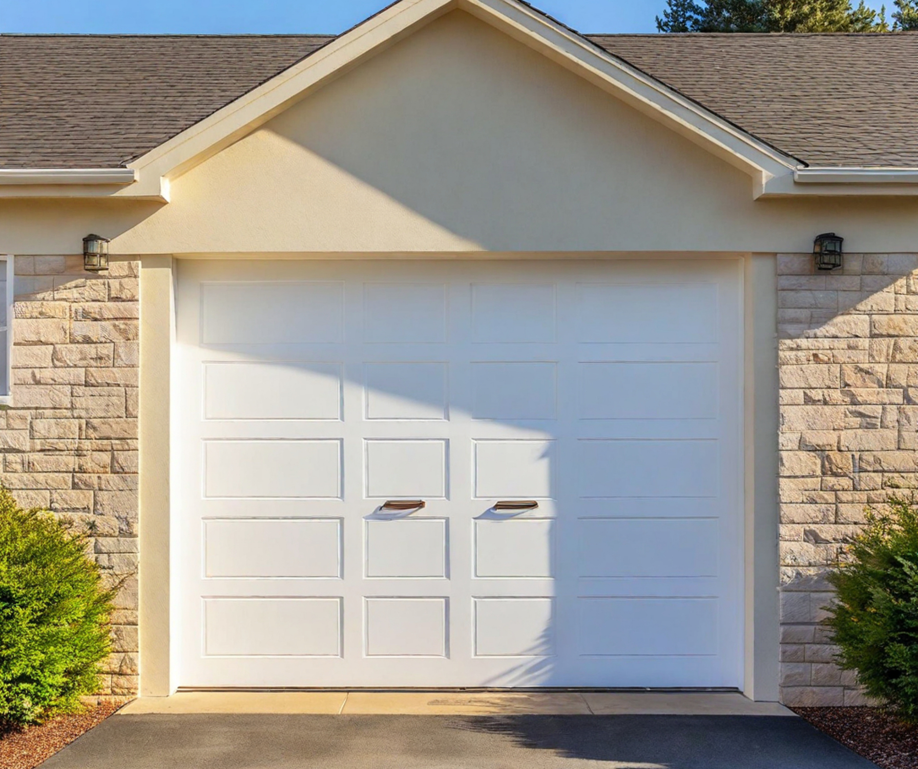 Bright suburban garage under a clear blue sky on a sunny day.